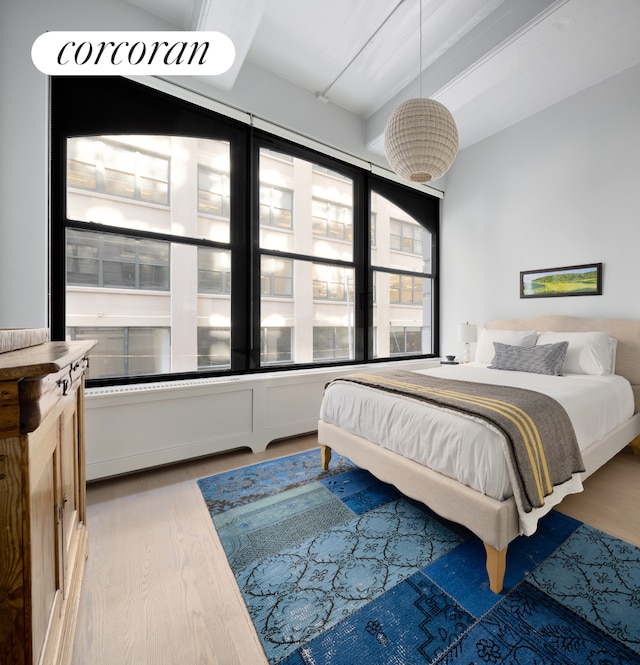 bedroom with wood finished floors