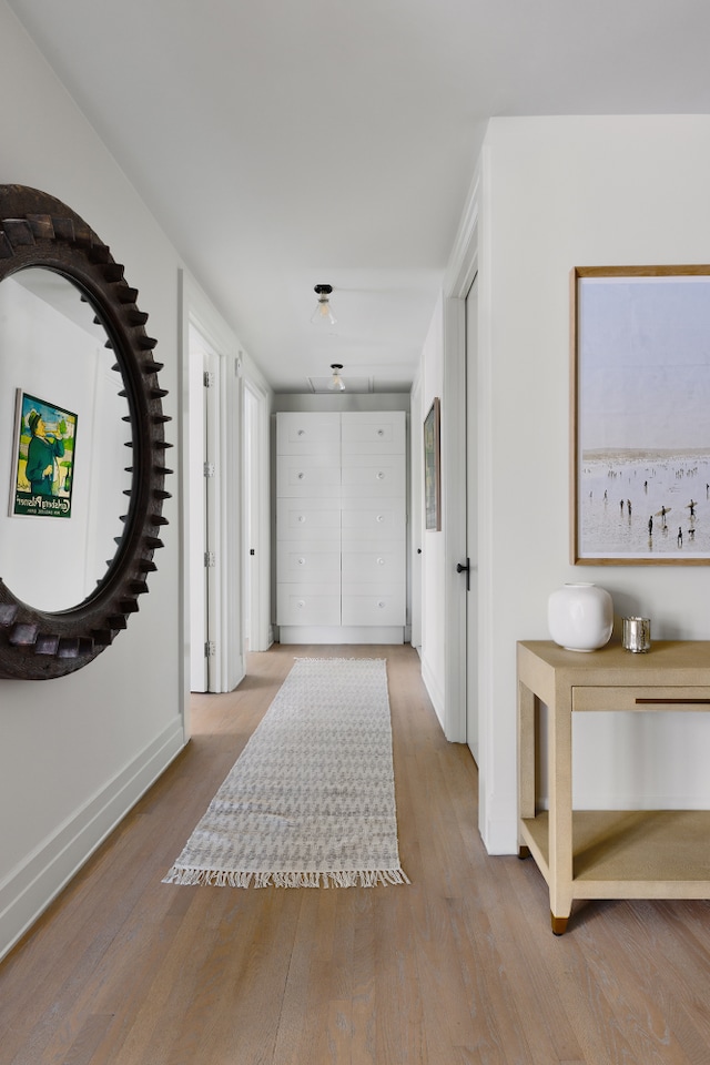 entryway with wood finished floors and baseboards