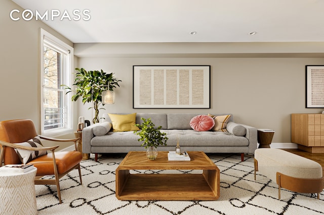 living area with plenty of natural light, wood finished floors, baseboards, and recessed lighting