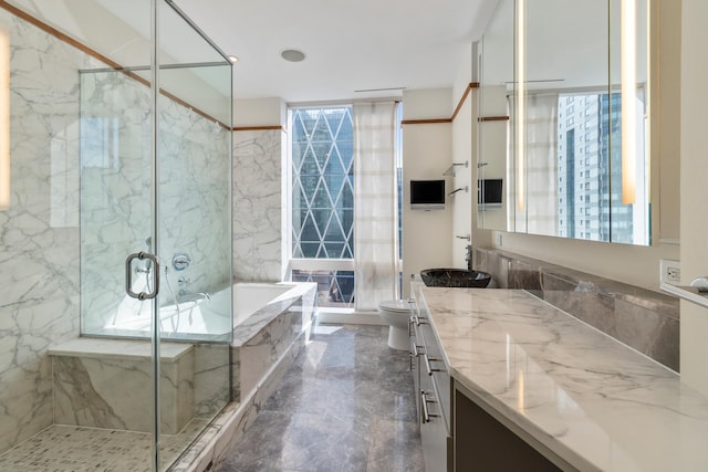 bathroom with a marble finish shower, marble tiled floors, toilet, vanity, and a bath