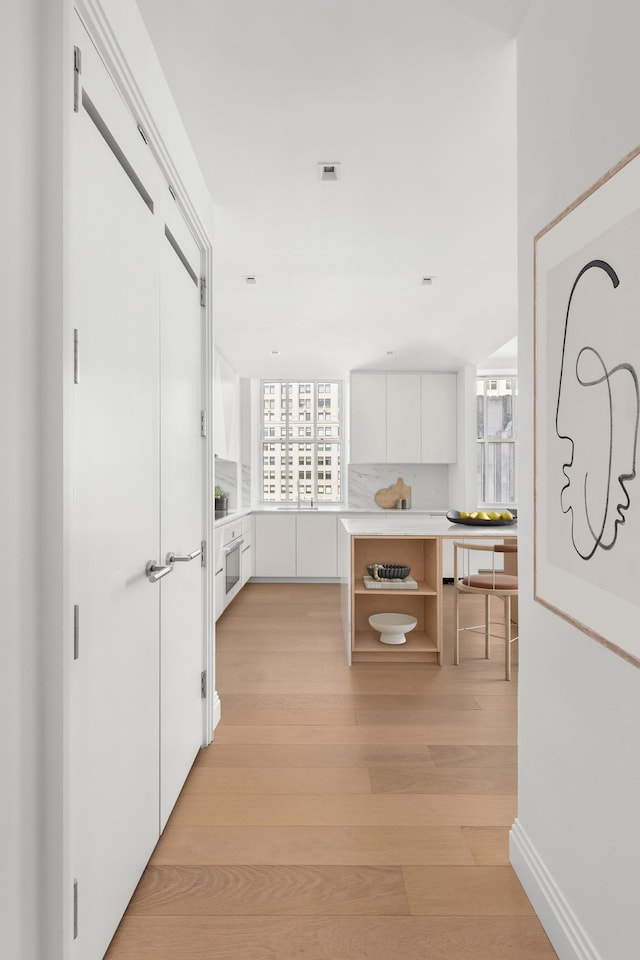 1 Wall St Unit 3212, New York City, NY 10005 - hall with light wood-style flooring