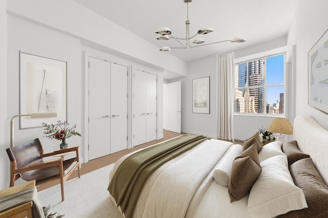 1 Wall St Unit 3212, New York City, NY 10005 - bedroom with a chandelier and two closets