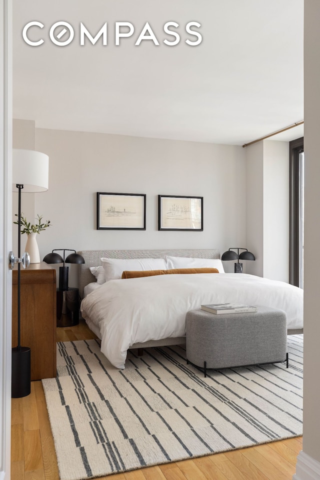 bedroom featuring wood finished floors