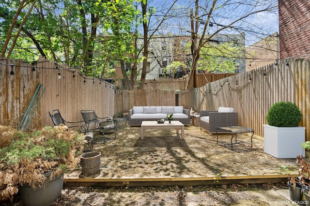 view of patio / terrace with an outdoor hangout area, a fenced backyard, and a deck