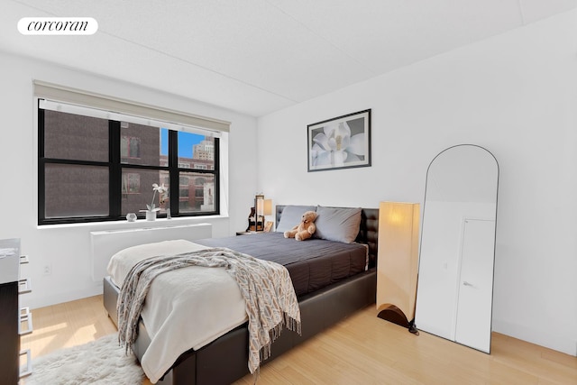 516 W 47th St Unit S4M, New York City, NY 10036 - bedroom with light wood-type flooring