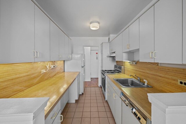 5500 Fieldston Rd Unit 8Cc, New York City, NY 10471 - kitchen with white appliances, a sink, under cabinet range hood, and tasteful backsplash