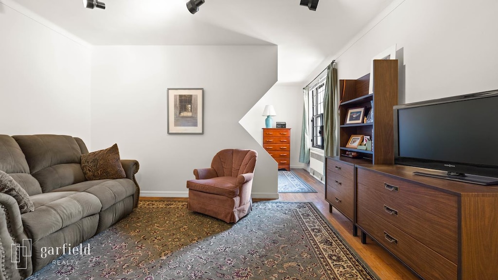 61 Oliver St Unit 2-P, New York City, NY 11209 - living room with wood finished floors and baseboards