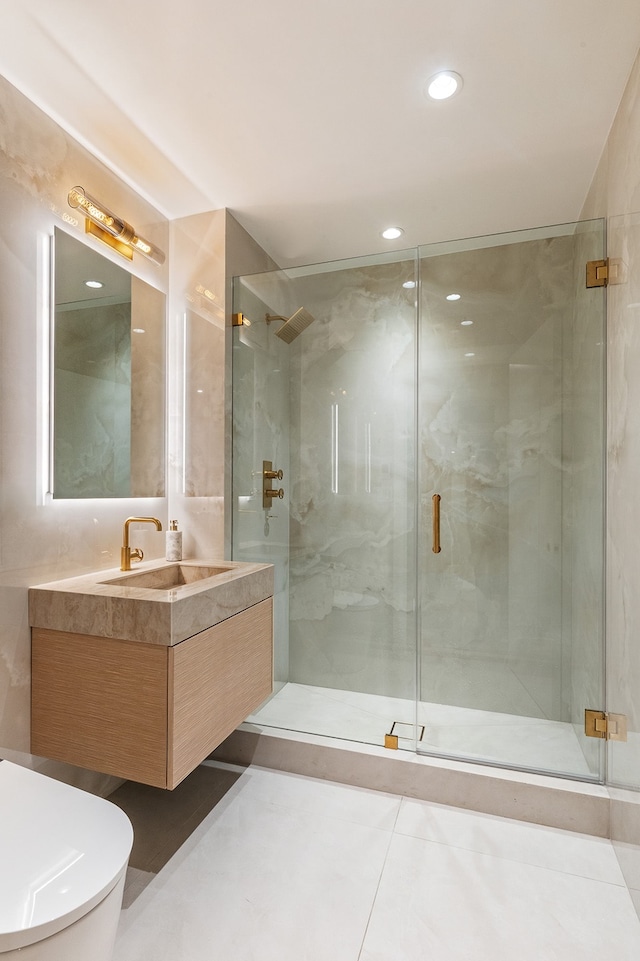 bathroom featuring toilet, a shower stall, vanity, tile patterned floors, and recessed lighting