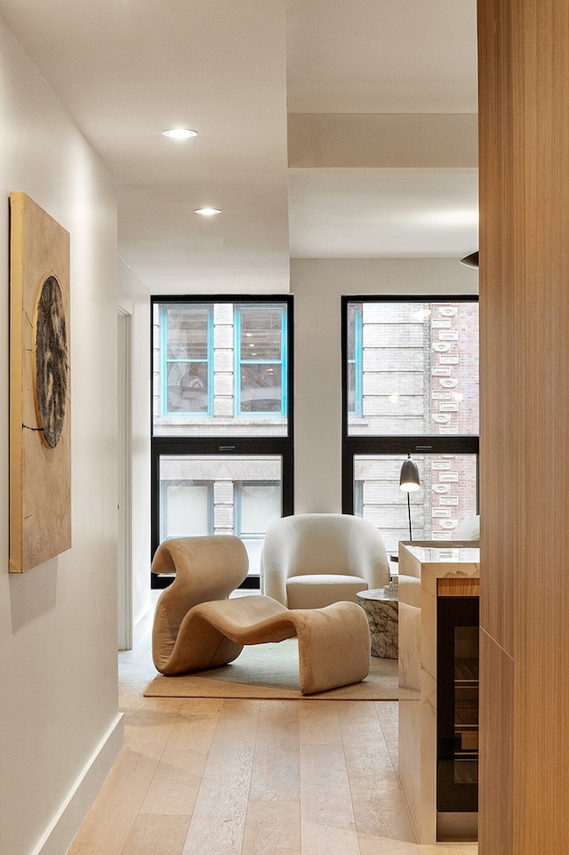 sitting room with wood finished floors and baseboards