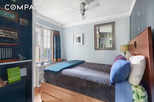 306 W 4th St Unit D3, New York City, NY 10014 - bedroom with ornamental molding, ceiling fan, and wood finished floors