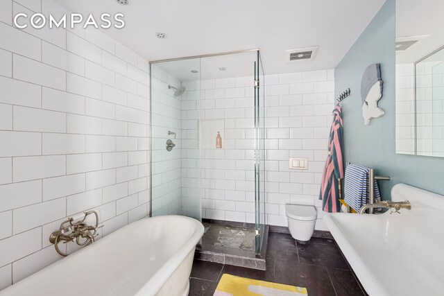 113A Columbia St, New York City, NY 11201 - full bathroom featuring a freestanding bath, tile walls, and a shower stall