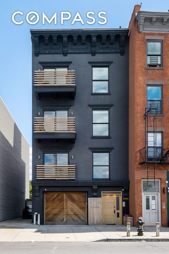 113A Columbia St, New York City, NY 11201 - view of building exterior with an attached garage