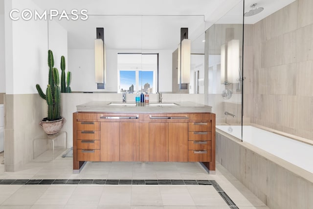 full bathroom featuring a combined bath / shower with rainfall shower, tile patterned floors, and vanity