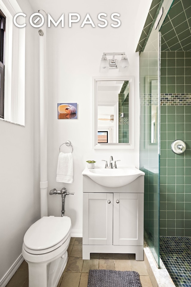 full bathroom featuring toilet, a shower stall, tile patterned floors, vanity, and baseboards