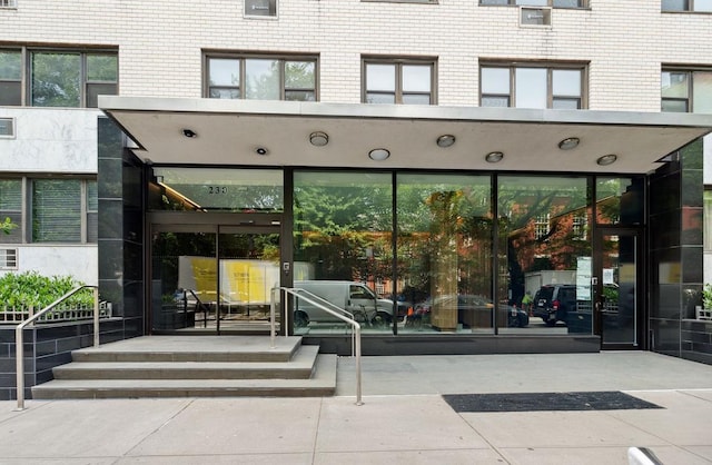 entrance to property with brick siding
