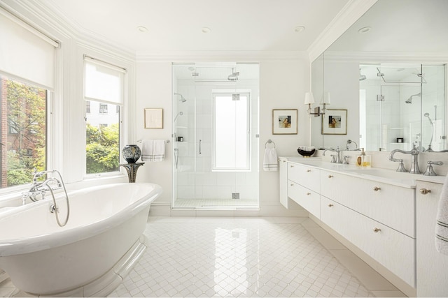 116 E 65th St, New York City, NY 10065 - bathroom featuring a shower stall, double vanity, a soaking tub, healthy amount of natural light, and ornamental molding