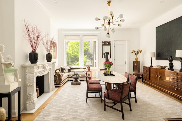 116 E 65th St, New York City, NY 10065 - dining space featuring a chandelier, ornamental molding, a fireplace with raised hearth, and light wood finished floors