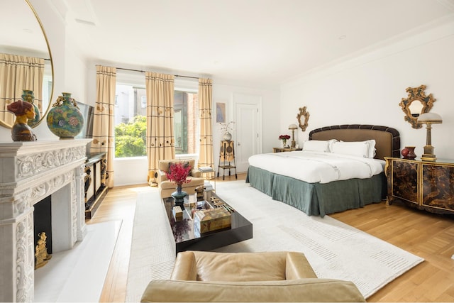 116 E 65th St, New York City, NY 10065 - bedroom with light wood-type flooring and crown molding