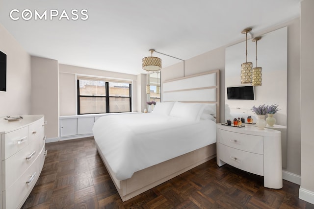 bedroom featuring baseboards