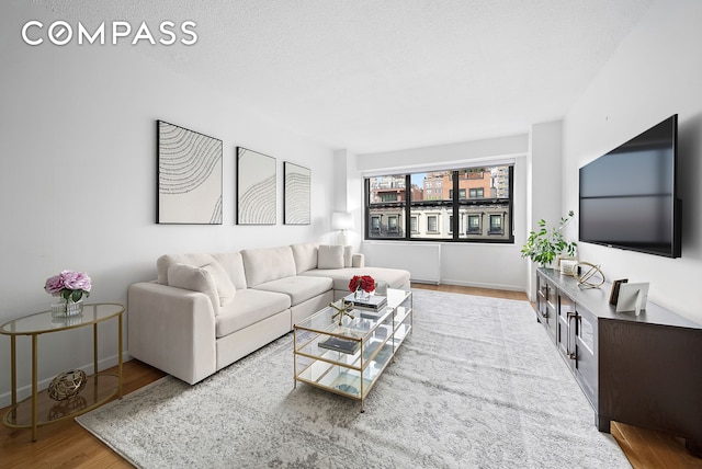 178 E 80th St Unit 5D, New York City, NY 10075 - living area featuring wood finished floors and baseboards