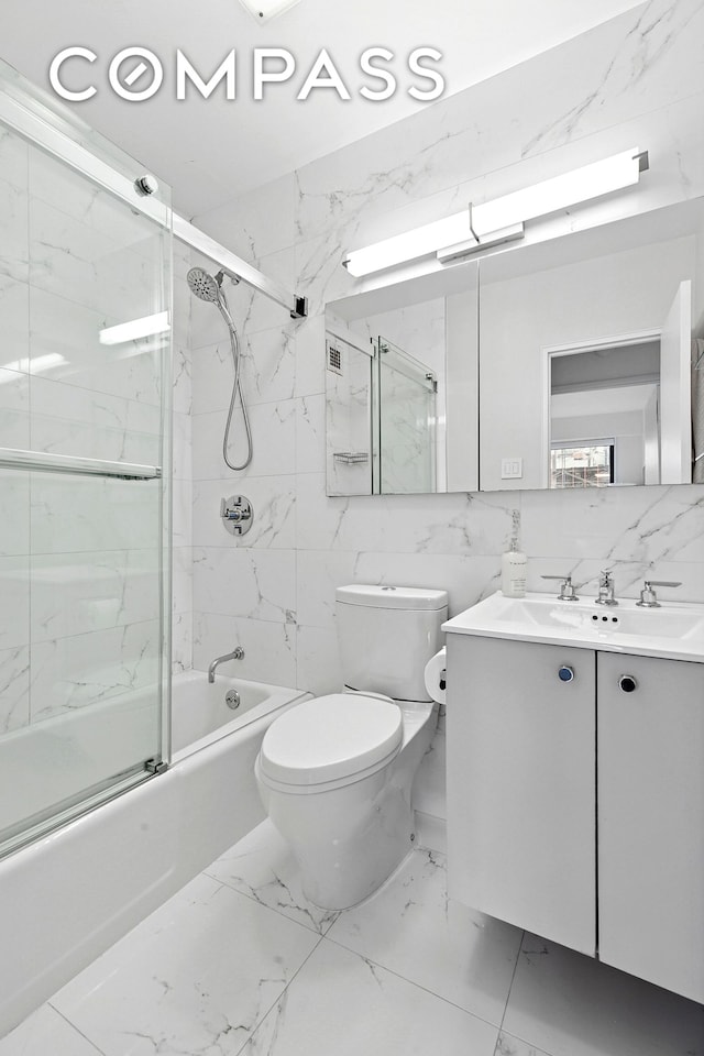 178 E 80th St Unit 5D, New York City, NY 10075 - bathroom with marble finish flooring, enclosed tub / shower combo, toilet, and vanity
