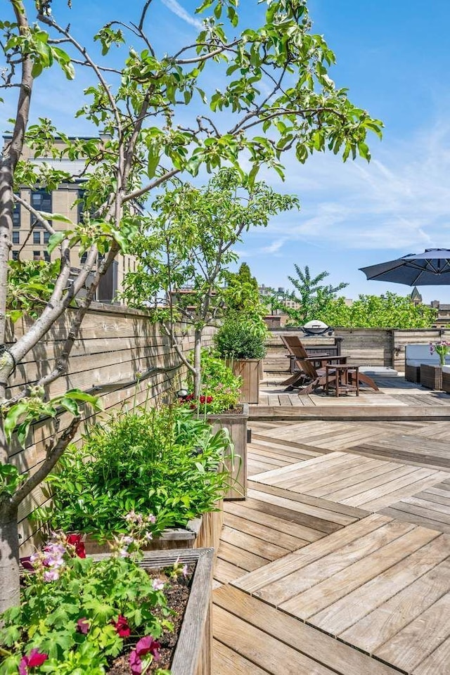 wooden deck featuring outdoor dining area
