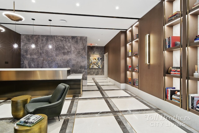 reception area featuring tile walls and recessed lighting
