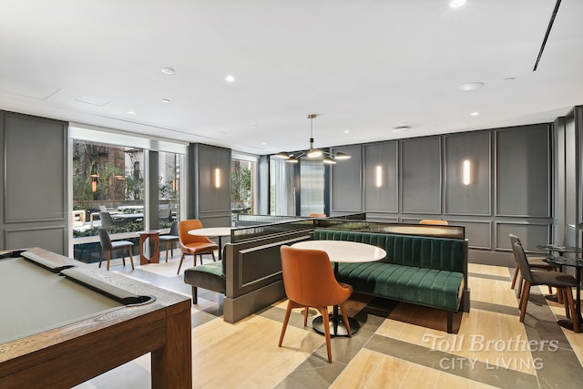 community lobby with a decorative wall and recessed lighting