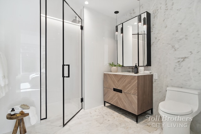 bathroom with a stall shower, marble finish floors, toilet, and vanity