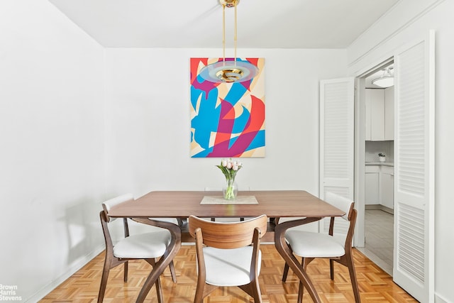 245 E 25th St Unit 5A, New York City, NY 10010 - dining room featuring baseboards