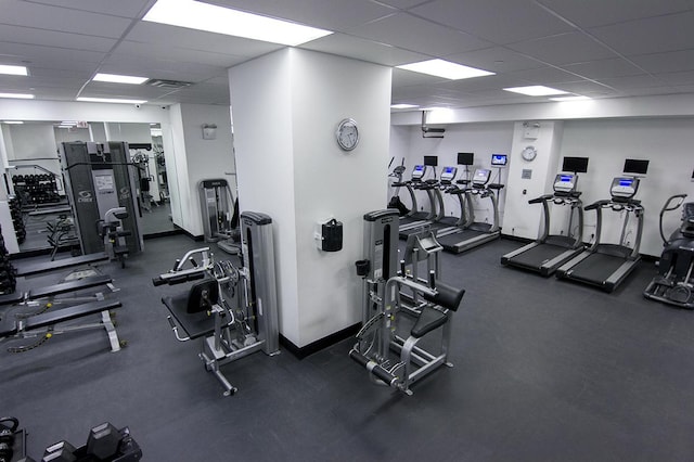 gym featuring a paneled ceiling