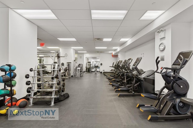 workout area featuring a drop ceiling