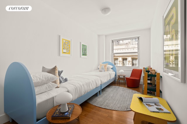 bedroom with wood finished floors