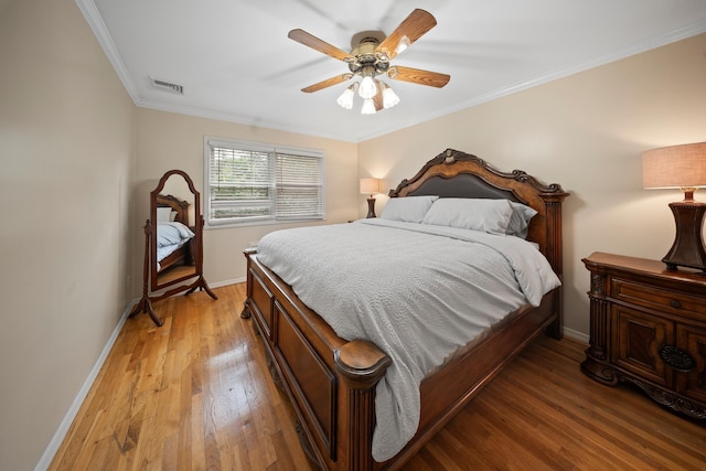 173-73 Croydon Rd, New York City, NY 11432 - bedroom with light wood-style floors, baseboards, ornamental molding, and a ceiling fan