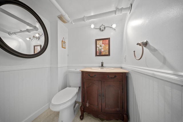 173-73 Croydon Rd, New York City, NY 11432 - bathroom featuring wainscoting, toilet, and vanity