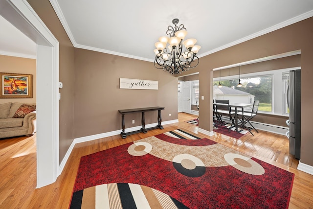 173-73 Croydon Rd, New York City, NY 11432 - dining space featuring wood finished floors, crown molding, a chandelier, and baseboards