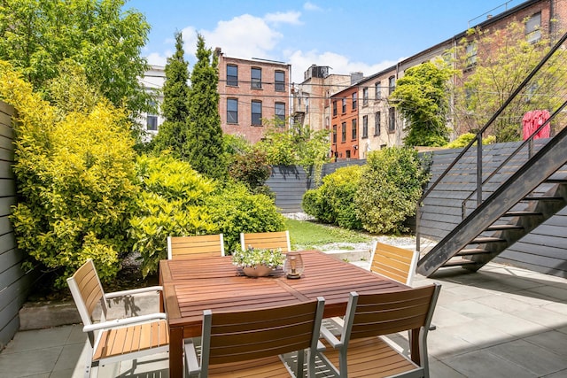 481 Macon St, New York City, NY 11233 - view of patio featuring outdoor dining area and stairs