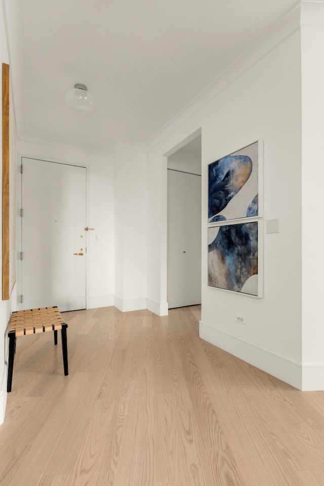 1965 Broadway Unit 20A, New York City, NY 10023 - playroom featuring light wood finished floors, baseboards, and crown molding