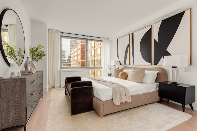 bedroom featuring light wood finished floors