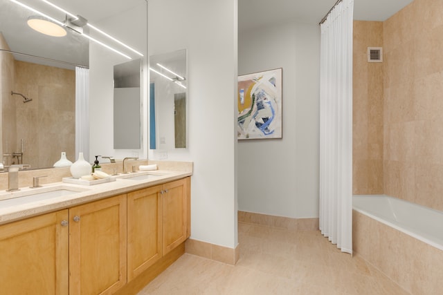 1965 Broadway Unit 20A, New York City, NY 10023 - bathroom featuring double vanity, tiled shower / bath combo, tile patterned flooring, and baseboards