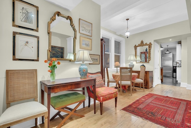 sitting room with hardwood / wood-style floors