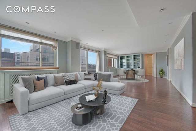 201 E 80th St Unit 16D, New York City, NY 10075 - living area featuring crown molding, wood finished floors, built in shelves, and baseboards