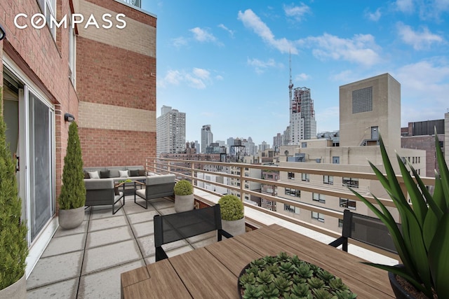 201 E 80th St Unit 16D, New York City, NY 10075 - wooden terrace featuring a view of skyline and an outdoor hangout area