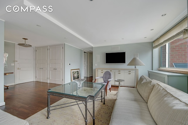 201 E 80th St Unit 16D, New York City, NY 10075 - living room with wood finished floors, ornamental molding, and baseboards