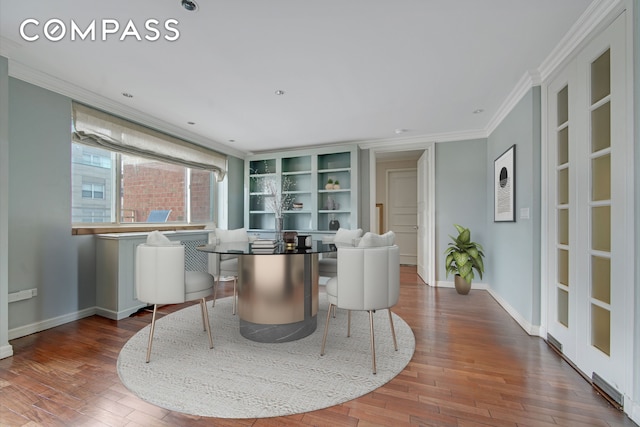 201 E 80th St Unit 16D, New York City, NY 10075 - dining room featuring ornamental molding, wood finished floors, and baseboards
