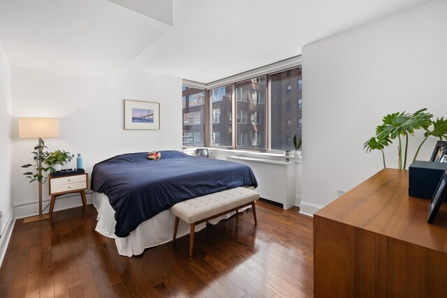 300 E 64th St Unit 9D, New York City, NY 10065 - bedroom featuring hardwood / wood-style flooring and baseboards