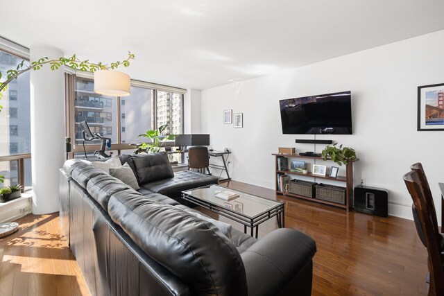 300 E 64th St Unit 9D, New York City, NY 10065 - living room featuring wood finished floors and an office area
