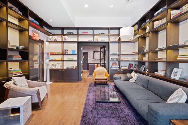 300 E 64th St Unit 9D, New York City, NY 10065 - living room featuring light wood-type flooring and recessed lighting