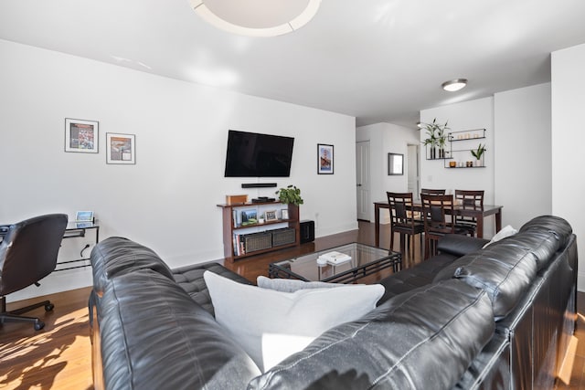 living room featuring wood finished floors and baseboards