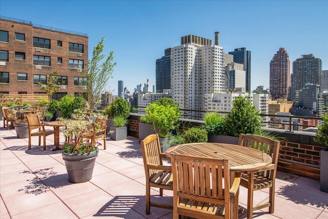 view of patio featuring a skyline view and outdoor dining space